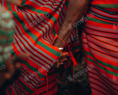 Preview: Women wearing African traditional clothes and holding hands