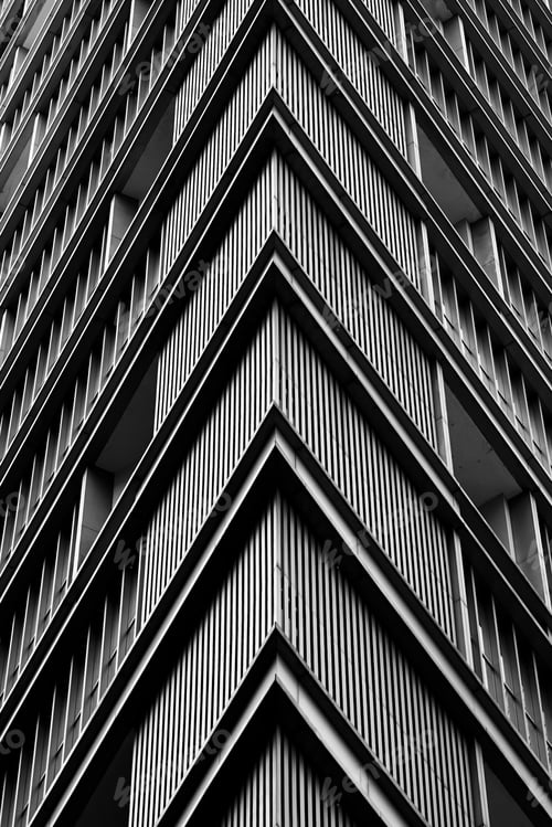 Preview: Grayscale shot of a residential building with balconies at daylight