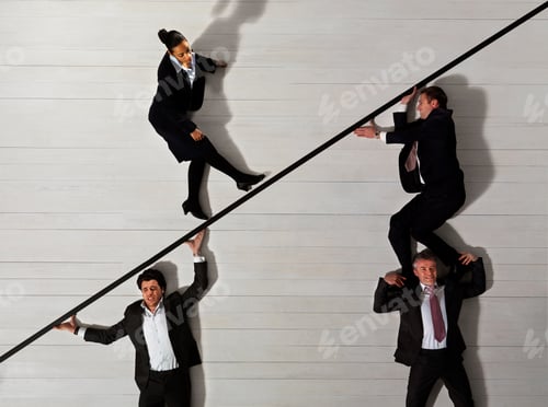 Preview: Business men supporting woman