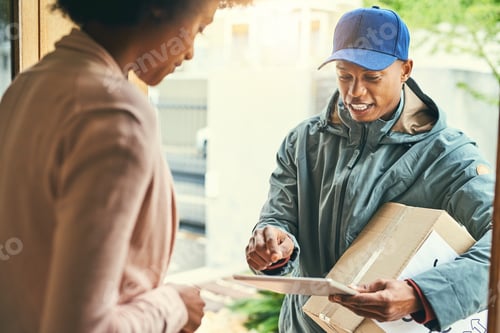 Preview: Shot of a courier using a digital tablet while making a delivery to a customer