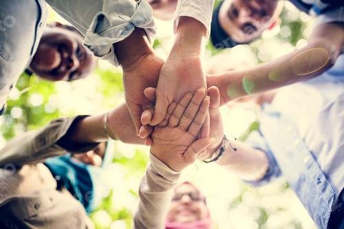 Preview: Group of diverse youth hands joined
