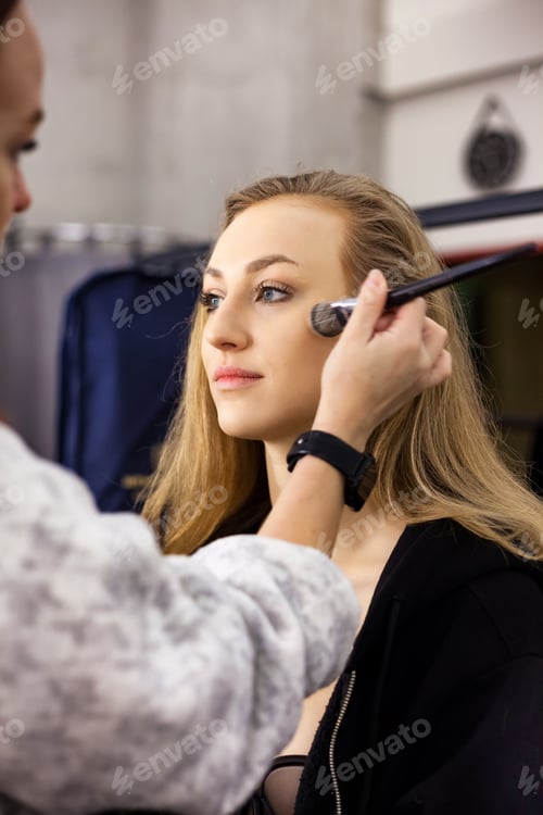 Preview: Young lady visit make up artist woman applying perfect makeup in beauty salon