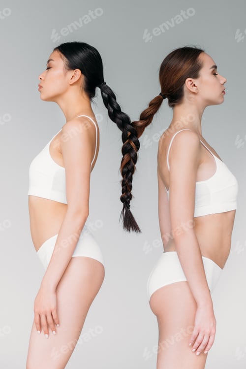 Preview: elegant attractive multicultural girls with hair in one braid, isolated on grey