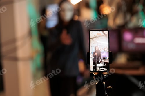 Preview: Masked hacker broadcasting live video to ask for ransom