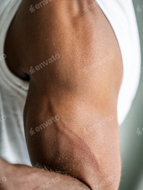 Preview: Closeup of a black person's muscular arm