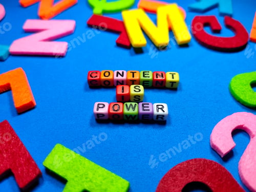 Preview: Selective focus.Colorful dice with word CONTENT IS POWER