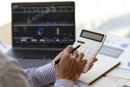 Preview: Businessman analyzing investment situation and business chart for financial planning.