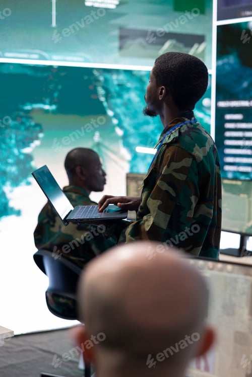 Preview: Military recruit reviewing radar surveillance footage on a big screen