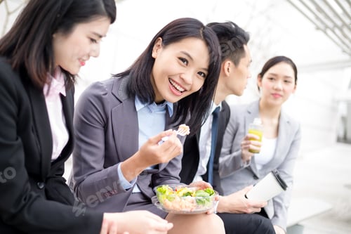 Preview: Business people having salad at lunch