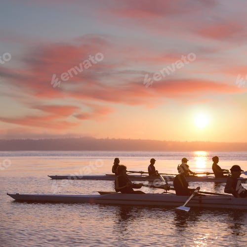 Preview: Seven people rowing at sunset