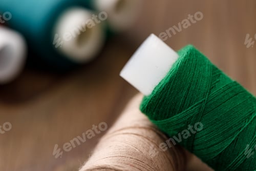 Preview: Close up of colored thread coils, thread spools background
