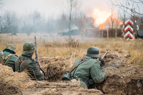 Preview: Re-enactors Dressed As German Wehrmacht Infantry Soldiers In World War II Hidden Sitting With Rifles
