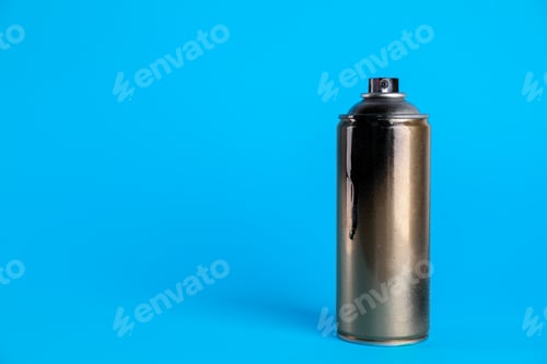 Preview: Used can of spray paint on light blue background. Space for text