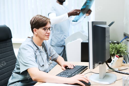 Preview: Doctor working with computer in office