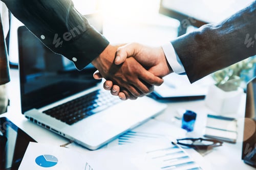 Preview: Business people shaking hands in the office