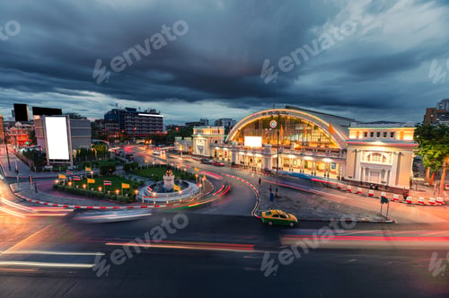Preview: Antique Hua Lamphong railway station illuminated with car traffic on the roundabout road