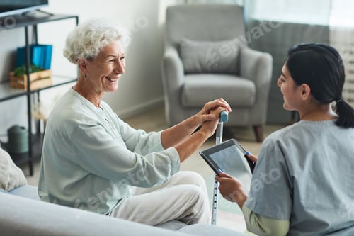 Preview: Nurse Talking to Senior Woman in Retirement Home