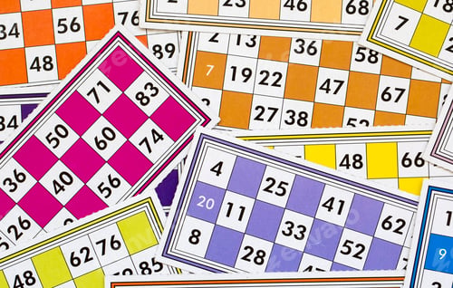 Preview: Colorful bingo game cards and numbers on white background, close up, isolated.