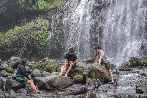 Preview: Three Adventures Friends Explore Lush Jungle And relax By Majestic Cascading Waterfall