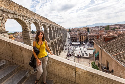 Preview: A young woman looking at the city from the Segovia Aqueduct, Castilla y León