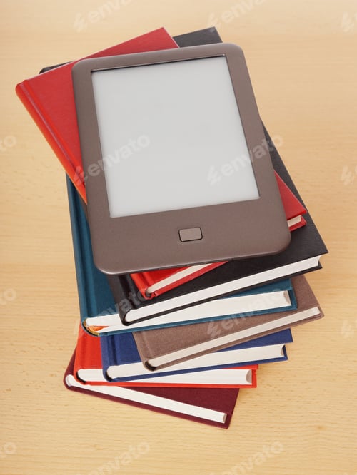 Preview: e-book reader on pile of books
