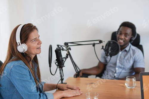 Preview: Podcast Recording With Two Adults Indoors At Table