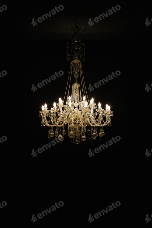 Preview: Beautiful crystal chandelier on black background. Vertical photo.