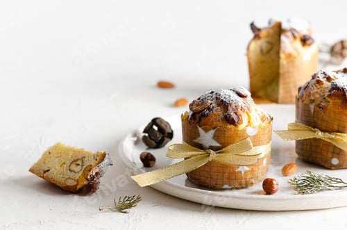 Preview: Panettone in a white plate on a white background.