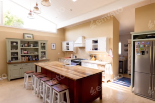 Preview: Stools arranged by wooden kitchen island and cabinets in modern kitchen, copy space