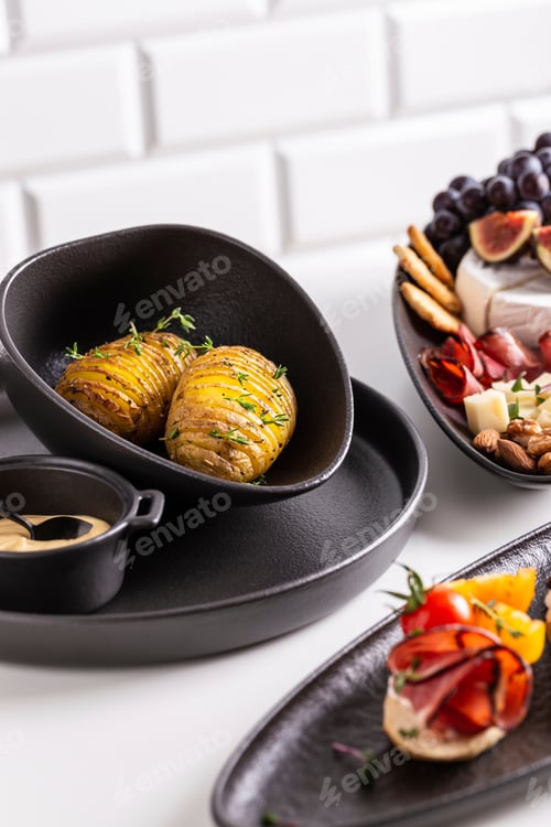 Preview: Dinner with grilled potato and assorted cheese, prosciutto, fruits and bruschetta