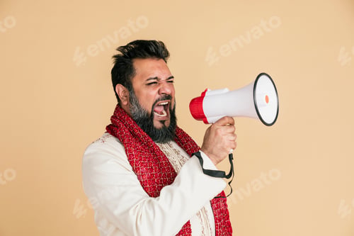 Preview: Indian man screaming into a megaphone