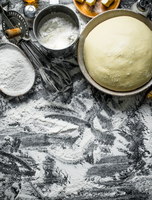 Preview: Dough and flour in bowls.