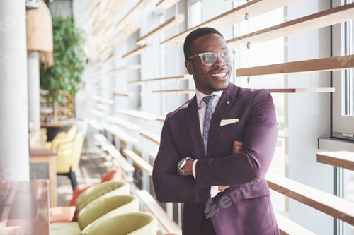 Preview: Happy smile of a successful African American businessman in a suit