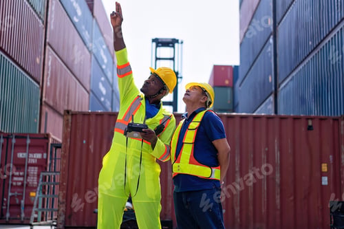 Preview: Engineer working in container storage yard fly drone looking top view check container arrangement