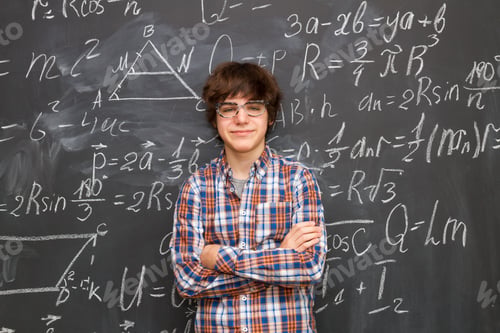 Preview: Boy and blackboard filled with math formulas