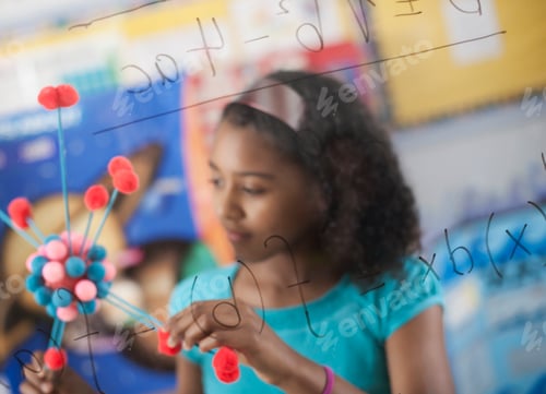 Preview: A girl holding a molecular structure and looking at a board of equations, science lesson