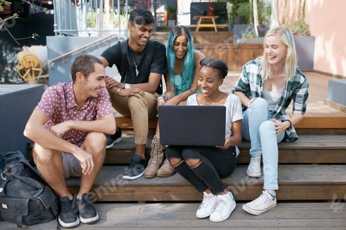 Preview: Shot of a group of young students enjoying a break outdoors on campus