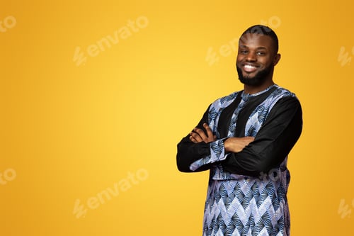 Preview: Smiling black man posing with arms crossed, free space