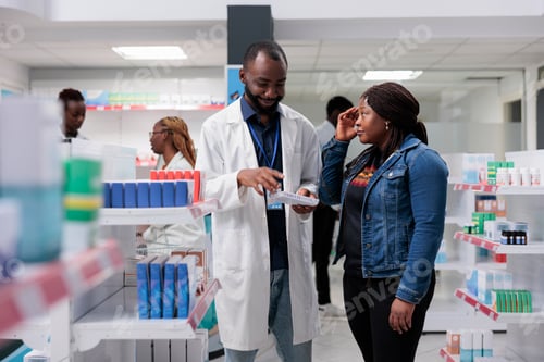 Preview: Pharmacy customer suffering from headache, buying painkiller