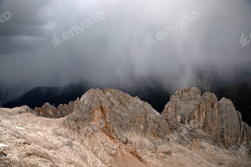 Preview: The view of Sassolungo and the Sella Group from Serauta in stormy weather in the Dolomites, Italy.