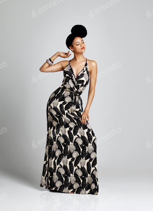Preview: Studio shot of a young woman posing against a grey background