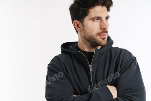 Preview: Young athletic sportsman posing and looking aside