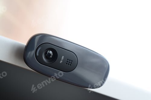 Preview: A modern web camera is installed on the body of a flat screen monitor