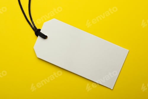 Preview: Cardboard tag with space for text on color background, top view