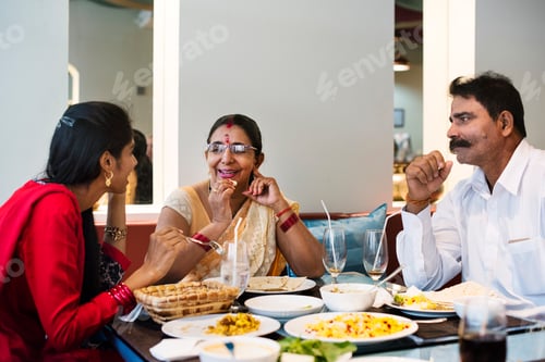 Preview: Family Enjoying Lunch Together in Restaurant