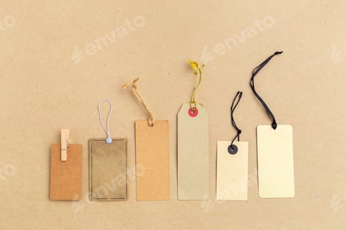 Preview: Different kinds of tags arranged on a flat surface for craft or organizational purposes