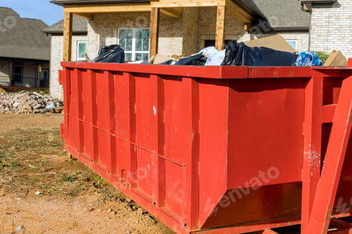 Preview: Home renovation maintenance a loaded dumpster near a construction