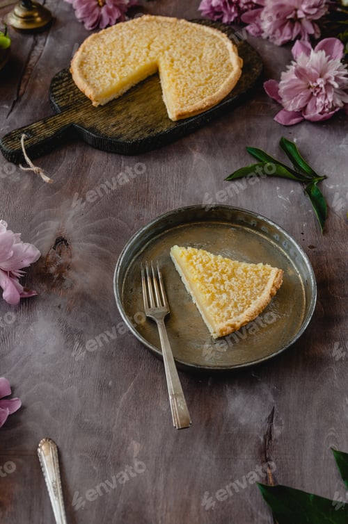 Preview: piece of tasty lemon pie on plate on wooden table