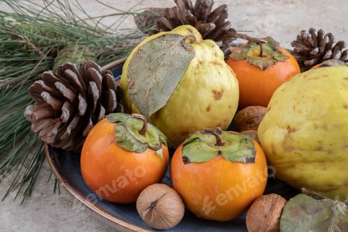 Preview: Fresh sweet fruits with nuts and pinecones