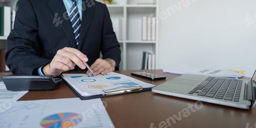 Preview: Accountant Preparing Financial Projections on Laptop for Business Growth